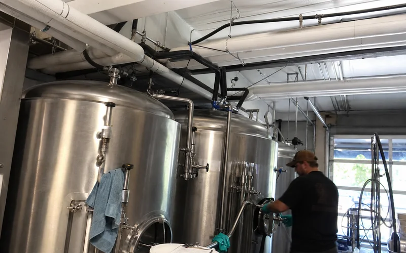 Insulated glycol supply and return lines running to brewery tanks
