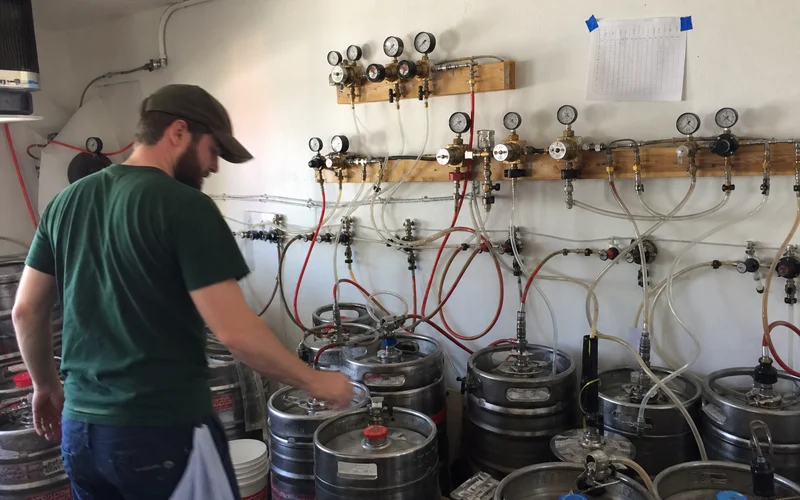 Primary and secondary beer gas regulators on a manifold feeding multiple keg lines