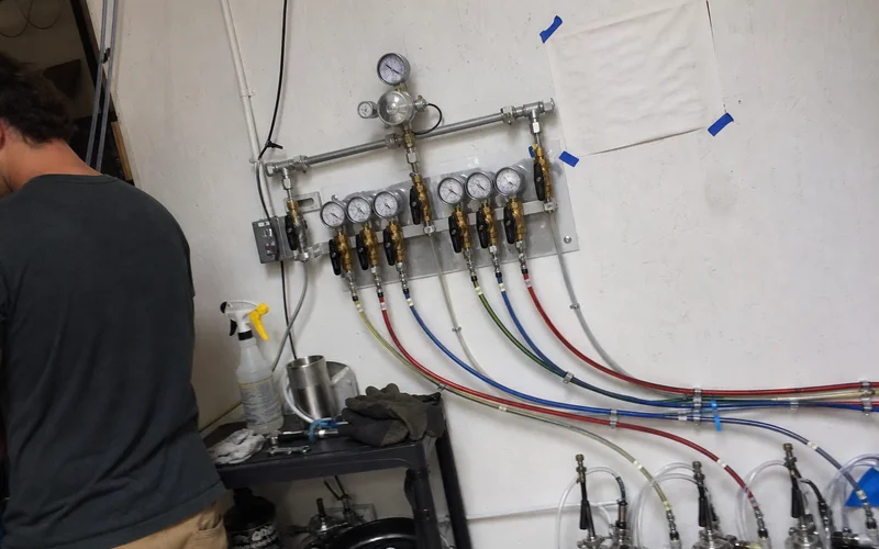 Primary and secondary regulators on a beer gas manifold feeding multiple draft lines