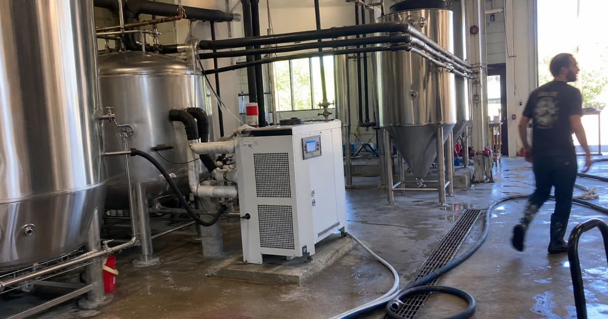 Central glycol chiller serving multiple fermentation tanks in a Portland brewery
