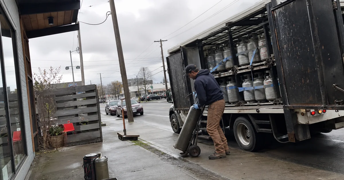 Gas delivery truck stopping at a commercial account on a Portland route