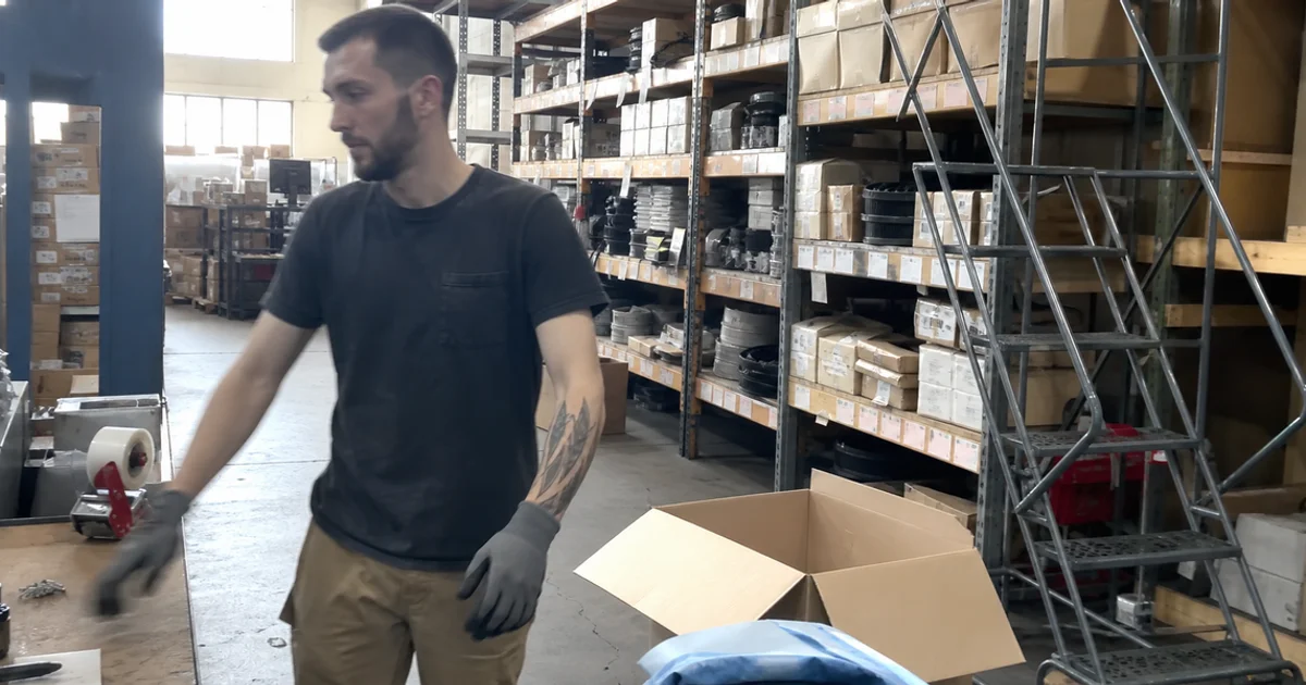 Shelves of commercial refrigeration replacement parts in a Portland parts department