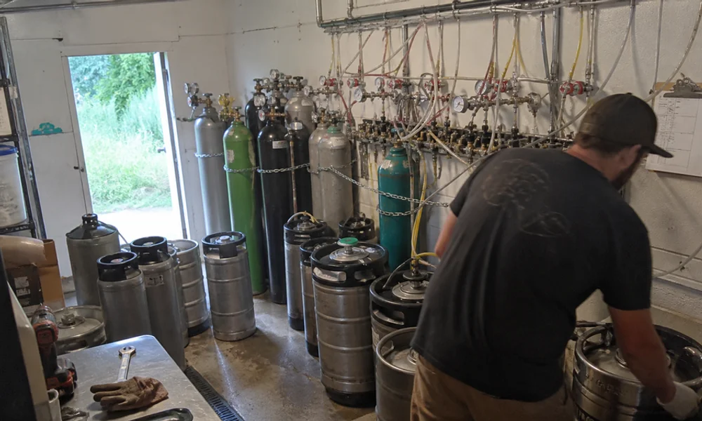 CO2 and nitrogen cylinders with regulators plumbed into a taproom draft system