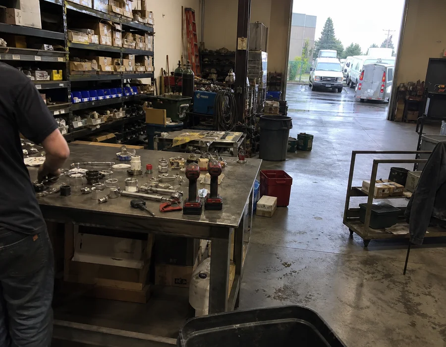 Interior of the Portland commercial refrigeration shop with parts shelving and service bays